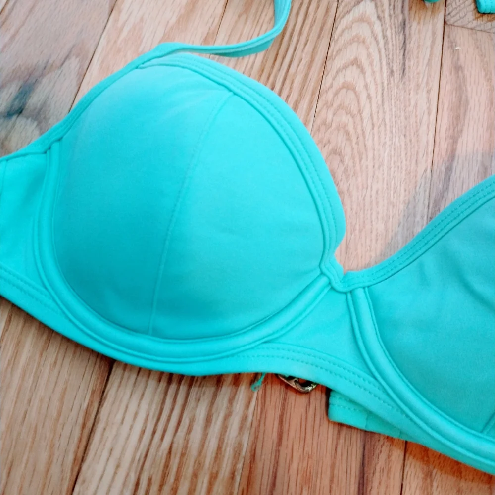VS bikini halter top with molded cups.  Size 34B. Some wear in the back clasp